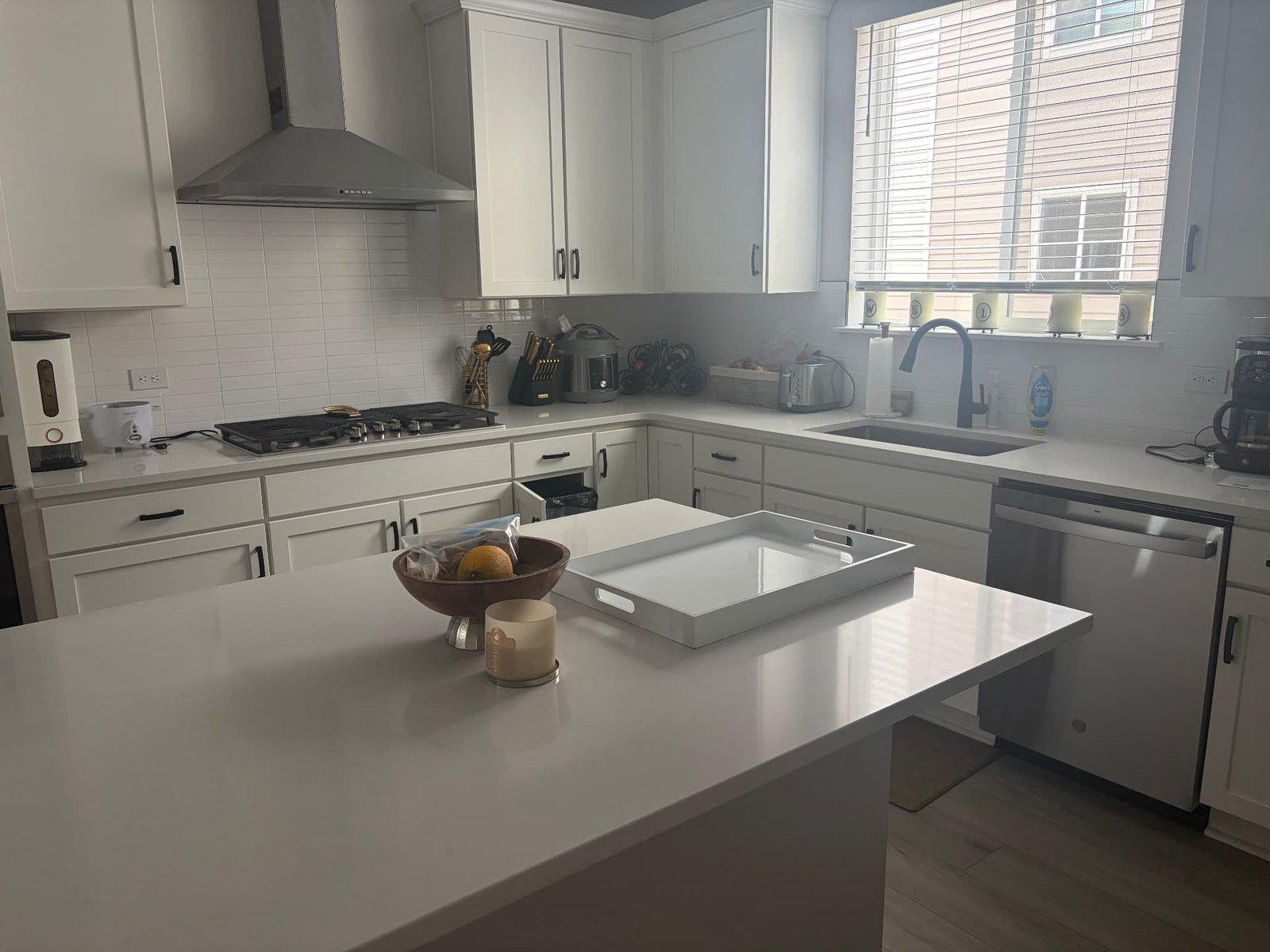 Quartz kitchen island and countertops wiped down during a deep cleaning appointment in a Colorado home